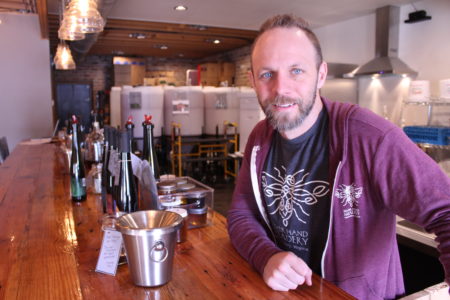 Glenn Lavender stands at the counter in the Silver Hand Meadery in Williamsburg. (Sarah Fearing/WYDaily)