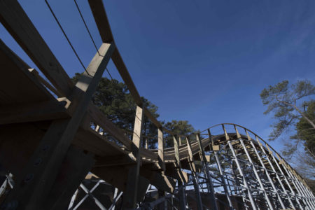 ride the wooden rails