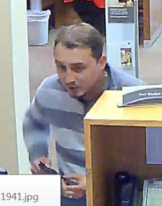Police are searching for this man, who they say conned a bank out of more than $1,000 by asking a teller to make change for a series of bills. (Courtesy YPSO)