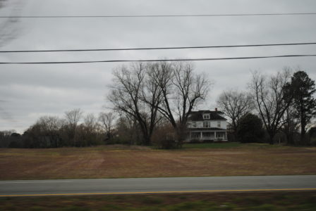 A house on the Taylor family's property sits in a large farm field on Richmond Road in Toano. (Sarah Fearing/WYDaily)