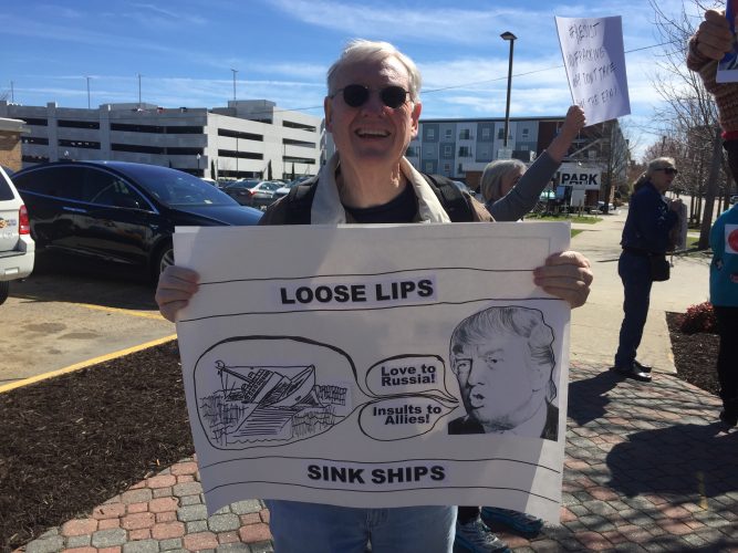 Mike Hatfield, a retired Navy captain and member of the activist group Indivisible, called Trump a risk to the nation’s safety. (Steve Roberts, Jr./ WYDaily)
