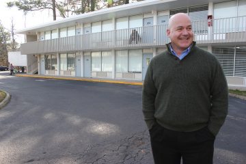 Quarterpath Inn owner Doug Pons stands in front of the motel in December. (Sarah Fearing/WYDaily)