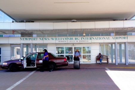 A taxi cab driver drops off a passenger at the entrance to the Newport News/Williamsburg International Airport (PHF) in Newport News. (Steve Roberts, Jr./WYDaily)