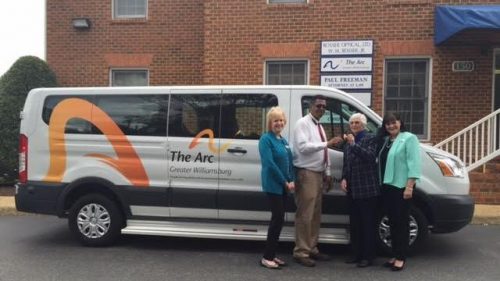 Pictured is Diane Schwarz, Arc board member, Harold Mason, Arc Transportation Director, Mrs. Dawson, and Pam McGregor, Executive Director for The Arc.
