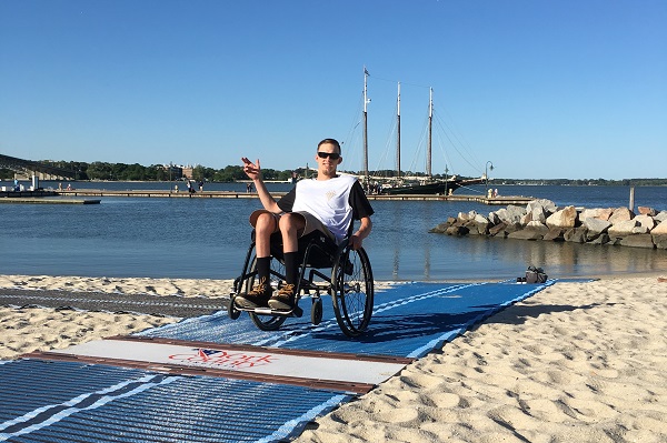 The new Mobi-Mat at Yorktown beach lets York County resident Dustin Ragan go for a swim independently. (Courtesy of Dustin Ragan).
