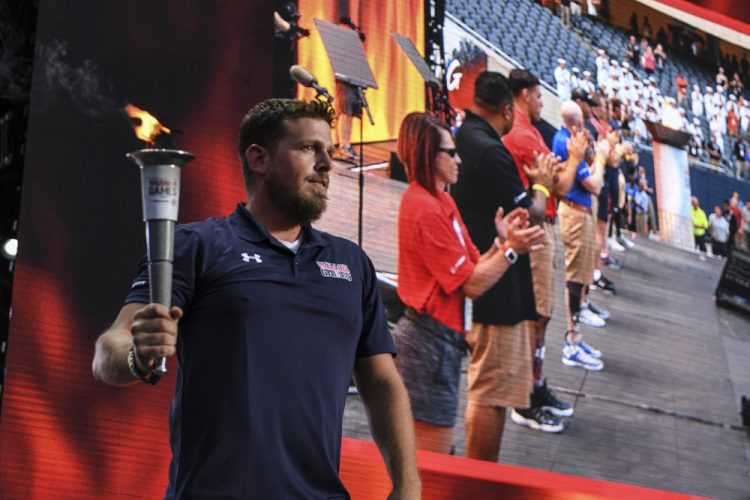 Nate Hamilton lighting the torch at the 2017 Warrior Games Opening Ceremony; Picture by Petty Officer 2nd Class Timothy Schumaker.