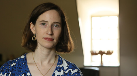 Maggie Fraser Kirsh, visiting assistant professor of Judaic Studies, researches how child survivors of the Holocaust were portrayed in fundraising materials following the war, and how that relates to the treatment of child refugees today. (Photo by Stephen Salpukas)