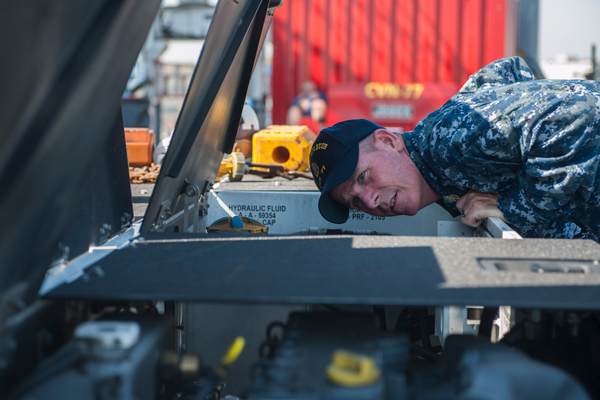 An increase in defense spending would be beneficial to Hampton Roads, Bob McNab says. Here, a senior technician inspects a shipboard tow tractor. (U.S. Navy photo by Mass Communication Specialist 3rd Class Christopher D. Gaines/Released)
