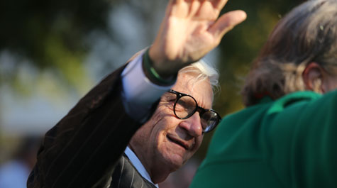 W&M President Taylor Reveley waves to the crowd from one of the cars in a 2017 parade. (Stephen Salpukas/W&M News)
