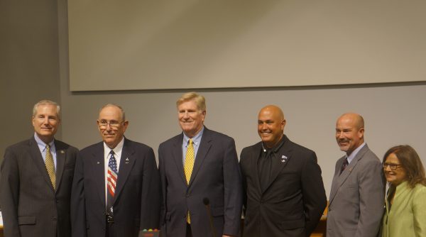 Candidates for the James City County Board of Supervisors. From left to right Moderator Michael Fox, Jim Icenhour, Tom Phillips, Michael Hipple, Joseph Swanenburg, and League of Women Voter's President Mary Schilling. (Courtesy Steve Roberts, Jr.)