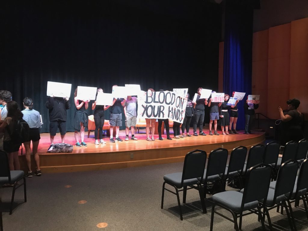 Students protest a presentation by the American Civil Liberties Union. (Courtesy Isabel Larroca/ The Flat Hat)