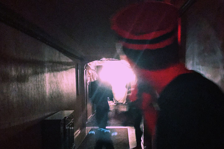 A bellhop leads a tour group through the haunted hotel. (Photo by Kristen Popham '20)