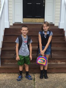 Tyler Thomson's children, Lincoln, 8, and Bryter, 10, pose for a photo on their first day of school this fall. Thomson's children spent several years riding the bus to Clara Byrd Baker Elementary School, even though it was a quarter-mile away. Now, the lack of pedestrian access might change. (Courtesy photo/Tyler Thomson)