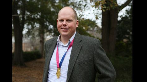 Joe Wheeless proudly exhibits the 1,000 mile medal he earned after challenging himself to go the distance in 2017. (Photo by Stephen Salpukas)