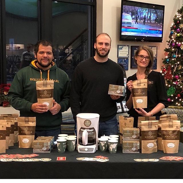 Cesar Murillo (left) and Lance Zaal (center) selling Mandela Cpffee. (Courtesy Mandela Coffee)
