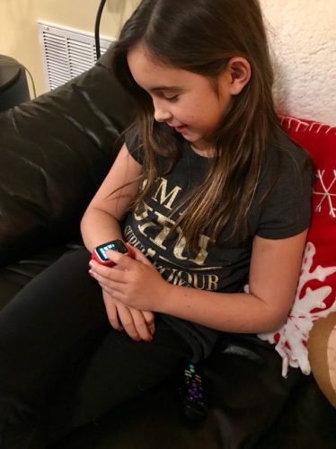 Marcela D'Costa's daughter using the GizmoGadget smartwatch (Courtesy Marcela D'Costa)