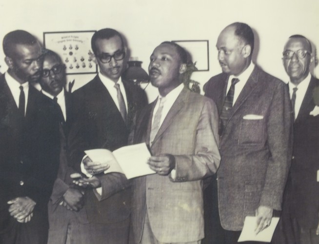 Rev. Dr. Martin Luther King speaks with members of First Baptist Church in Williamsburg, including Pastor David Collins (right) in June 1962. (Photo courtesy First Baptist Church)