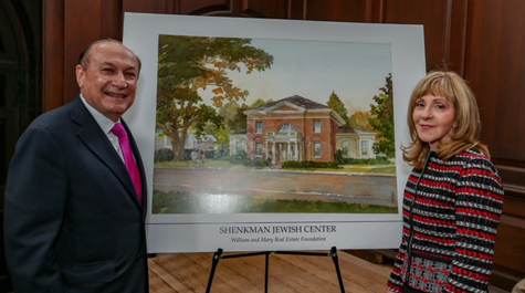 Mark R. Shenkman and Rosalind Shenkman stand next to a rendering of the new center. (Courtesy photo/Skip Rowland '83)