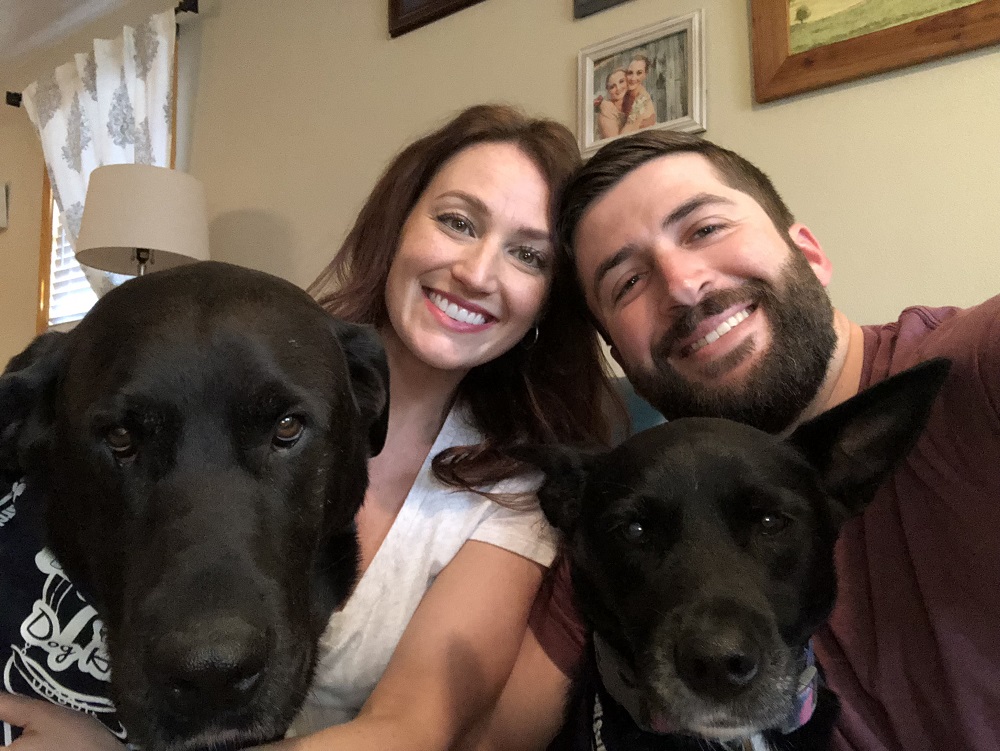 Mara and Matthew pose with their two dogs, Nucky and Logan. (Courtesy Matthew Dudley)