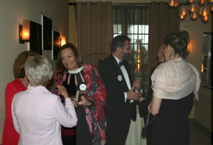 At the third annual Avalon wine tasting, volunteers dress as up and serve wine to guests. Before the event, Clement Brown, who chooses the selection of wines for the night, meets with the volunteers and teaches them information about each wine they are serving. (Photo courtesy of Priscilla Caldwell)
