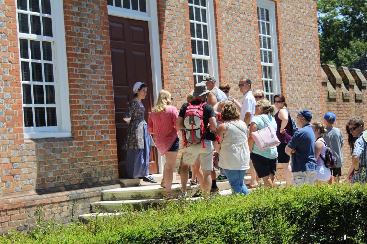 King leads a group of guests on a tour at the Governor's Palace. King is one of hundreds of interpreters who work at Colonial Williamsburg. (Sarah Fearing/WYDaily)