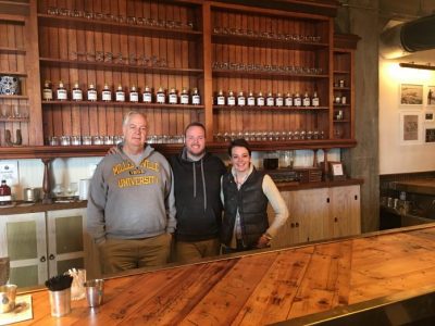 Stephen King (left), Owen King (middle) and Kara King (right) stand in the Ironclad Distillery. (HNNDaily/ Troy Jefferson)