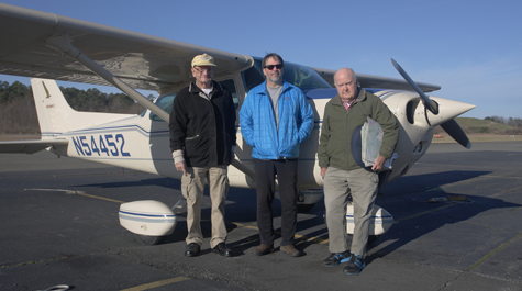 Captain “Fuzzzo” Shermer, a former fighter pilot, and two William & Mary biologists, Bryan Watts and Mitchell Byrd (pictured left to right) have spent the past 25 years making flights above the James River to keep a census of its eagle population. (Courtesy photo/Bart Paxton)