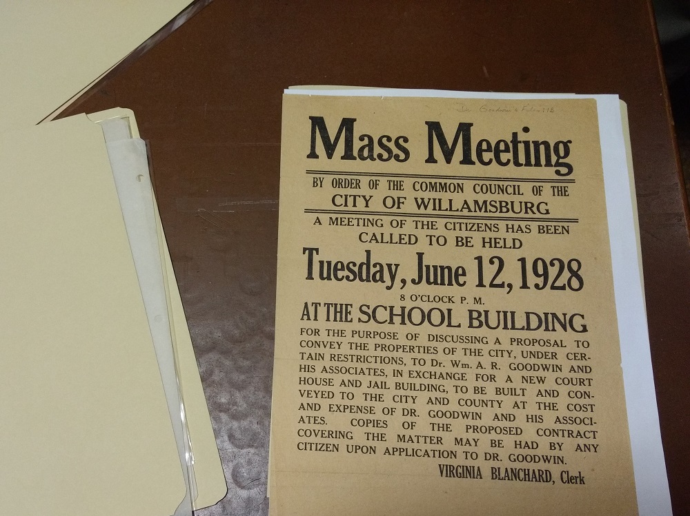 A flyer stored in the archives announcing a public meeting regarding the acquisition of land for Colonial Williamsburg. (Andrew Harris/WYDaily)