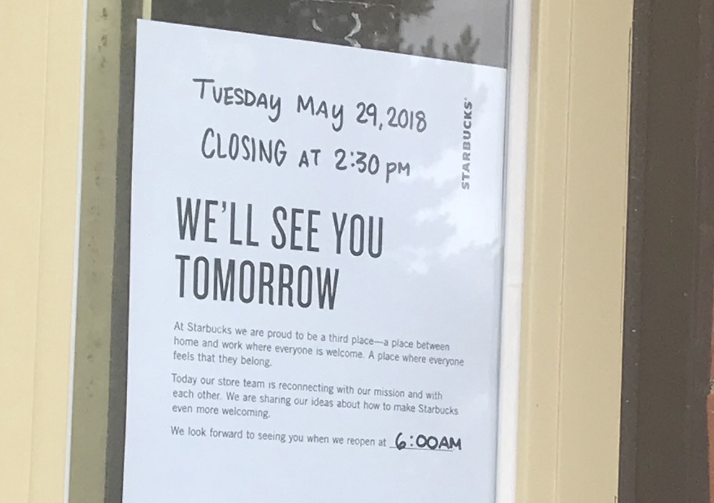 A sign hung on an area Starbucks tells customers the store will be closed for the afternoon. (Bonny Markwith/ WYDaily)