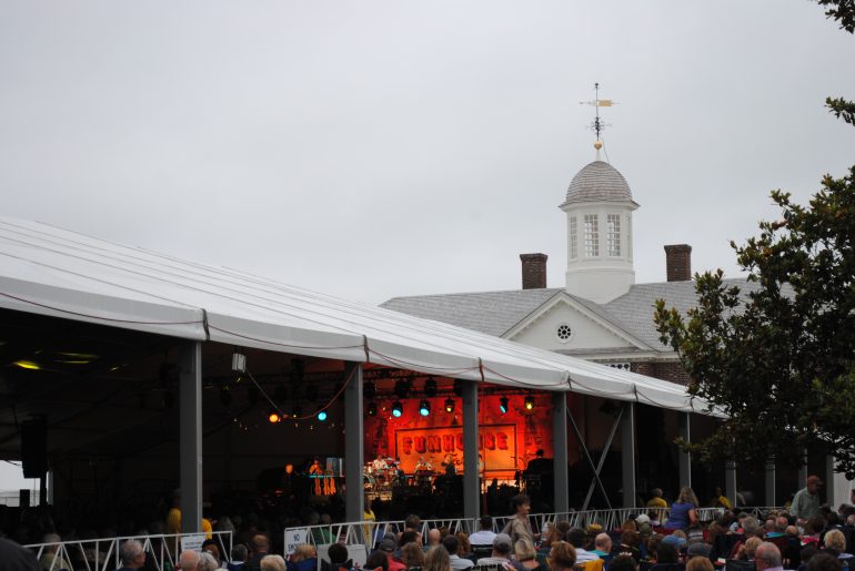 The Art Museums of Colonial Williamsburg building stands tall behind the Funhouse Fest tent where Bruce Hornsby performed Friday night. (WYDaily/Sarah Fearing