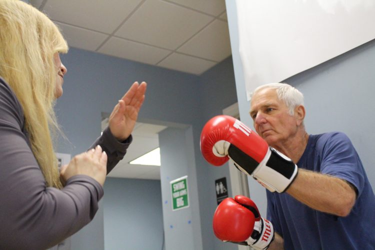 Rachel Carter, program coordinator, and Scott Brubaker aim to create high-energy workouts to promote positivity in the class. (WYDaily/Alexa Doiron)