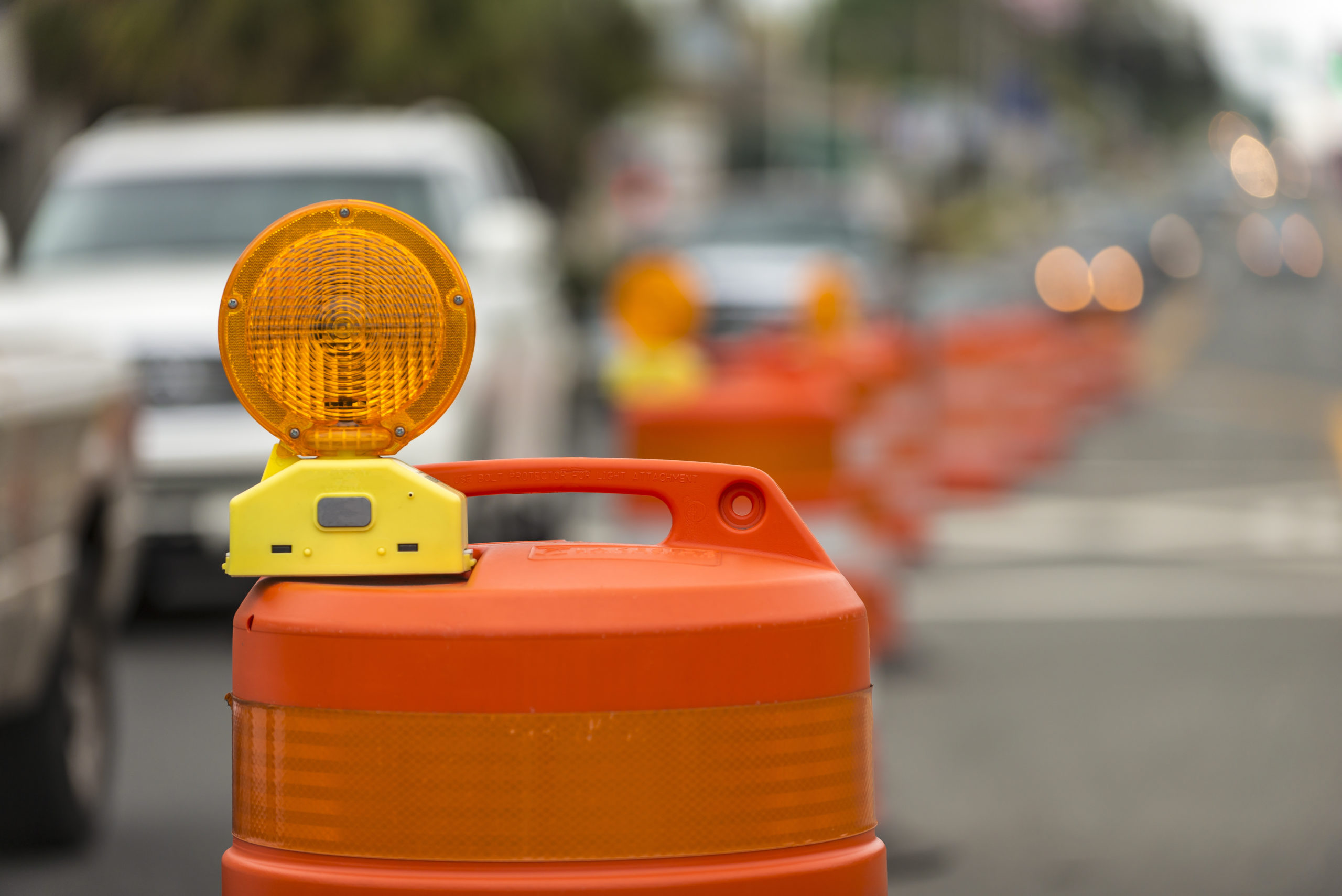 Photo of a road construction barrel.