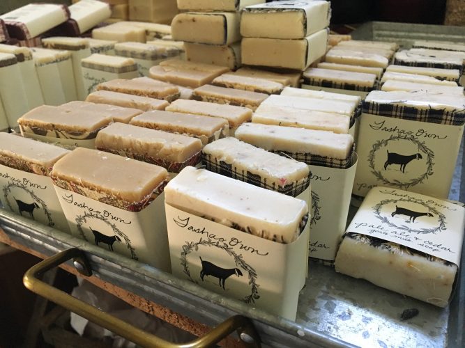 Each bar is hand-cut and individually wrapped with a piece of cloth and a label. Every part of Anderson's product holds meaning in some way, with the cloth representing her six daughters and the wreath representing the herbs. The personal touches are a part of what makes her product special, she said. (WYDaily/Alexa Doiron)