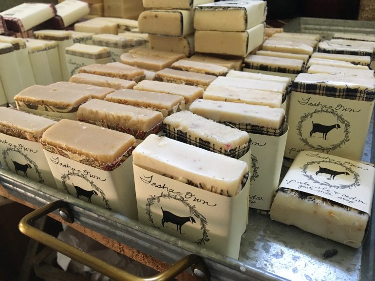 Each bar is hand-cut and individually wrapped with a piece of cloth and a label. Every part of Anderson's product holds meaning in some way, with the cloth representing her six daughters and the wreath representing the herbs. The personal touches are a part of what makes her product special, she said. (WYDaily/Alexa Doiron)