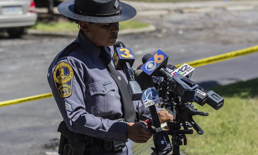 Virginia State Police spokeswoman Sgt. Michelle Anaya reads a statement from the family of Jean Lonchak Danylko, who was killed when a helicopter crashed into a townhouse building in the Bristol Commons neighborhood in Williamsburg, on Monday, July 9, 2018. (WYDaily/Bryan DeVasher)