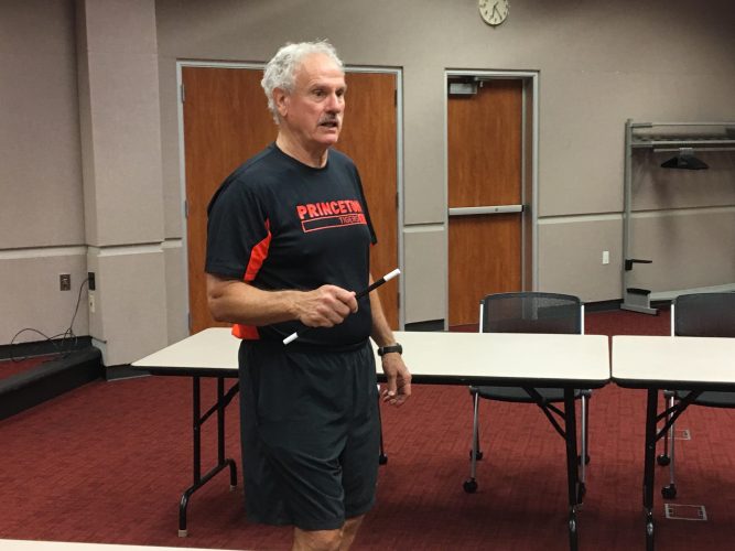 Ron Grossman started off the June meeting of the Society of American Magicians by tapping his magic wand on a table. (WYDaily/Alexa Doiron)