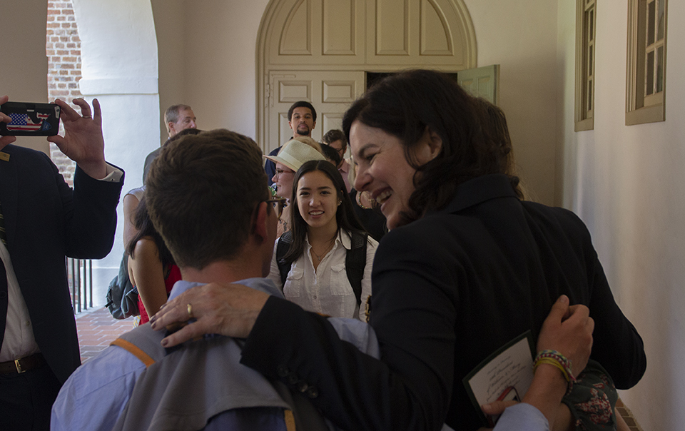 New WIlliam & Mary President Katherine A. Rowe greets a well-wisher while others wait to meet her after her swearing in Monday, July 2, 2018, at the Wren Building. (WYDaily/Bryan DeVasher)