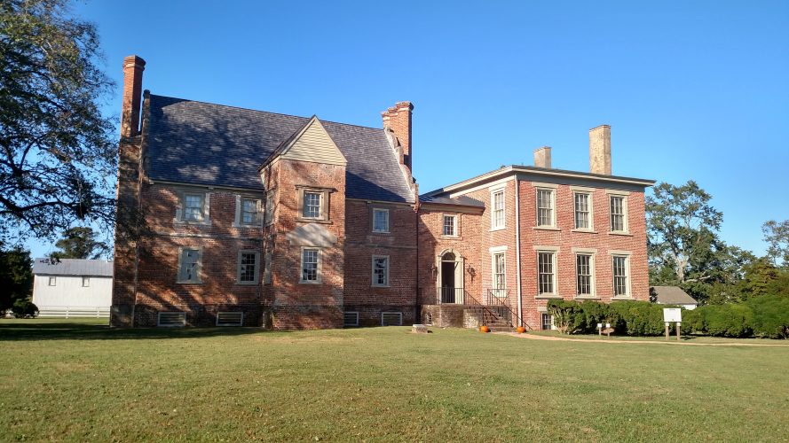 Several rooms include photographs of former residents and their family members and antiques that date to 1665, including a baby’s cradle believed owned by the Allen family. (Courtesy Bacon's Castle)