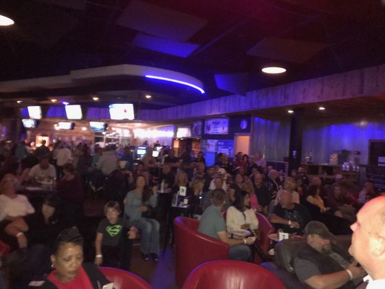 Virginia Peninsula residents Gordy Price and James Person have produced a fictional film based on stories about Crawford Road, Yorktown, and the unsolved Colonial Parkway murders in the late 1980s. Here, Boathouse Live fills with viewers at the "Crawford Road" premie Oct. 17. (WYDaily/Courtesy James Person)