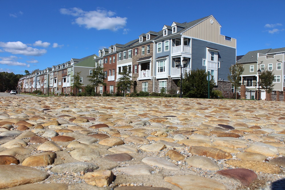 The cobblestones at the intersection of Casey Boulevard and Settlers Market Boulevard in New Town are being removed in favor of asphalt. (WYDaily/ Andrew Harris)