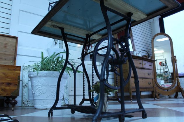 The base for this table is an old sowing machine, and the top is a porcelain table top the Wieners refurbished. (WYDaily/ Andrew Harris)