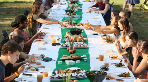 Events such as the annual Farm to Fork dinner allow William & Mary's Office of Sustainability to showcase various elements of sustainability efforts on campus. Dining Services partnered with the Williamsburg Farmers Market to prepare fresh local foods for a family-style dinner in the Sunken Garden. (WYDaily/Courtesy Stephen Salpukas)