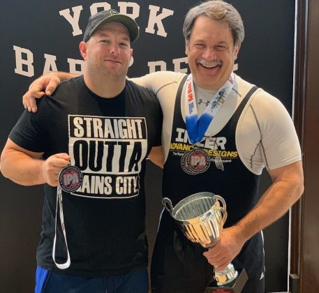 Jeremy Elston and Knight Smith pose for a photo after the International Powerlifting Association National Powerlifting and Bench Press Championships Nov. 17 and 18. (WYDaily/Courtesy Jeremy Elston)