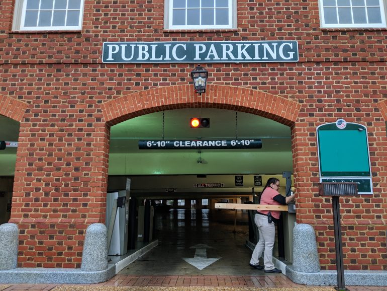 Parking Garage Superintendent Vanessa Nash takes down one of the garage gates at the Prince George Parking Garage in January 2019. The City of Williamsburg is switching to a gateless, license plate-based system at the parking garage. (WYDaily/Sarah Fearing)