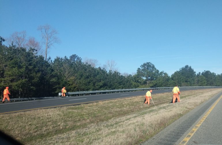 In this WYDaily photo from March 2019, inmates from the Virginia Peninsula Regional Jail can be seen almost weekly on roadsides and other public areas. The inmates mow lawns, pick up litter and rake leaves. (WYDaily file photo)
