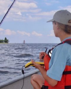 Karinna Nuñez of CCRM maps Maryland's Chesapeake Bay shoreline via GPS off the shore of Calvert County. (WYDaily/M. Berman/VIMS)