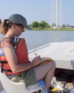 Tami Rudnicky of CCRM uses a hand-held GPS unit to tag GPS coordinates with the shoreline conditions she observes along the shoreline in Virginia. (WYDaily/CCRM/VIMS)