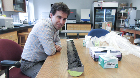 Nick Balascio examines an earth core in his McGlothlin-Street Hall laboratory. His is a co-author on a “Nature Communications” paper that reports a discovery that a deep-water Atlantic current system is a 400-year harbinger of climate change. (WYDaily/Courtesy Joseph McClain)