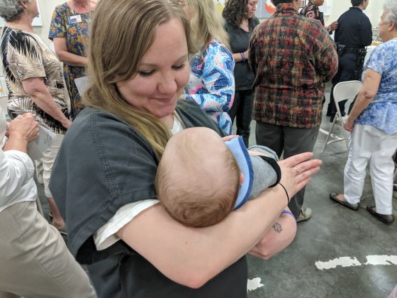 Allison Bellamy, 31, holds her baby, Brantley, on Tuesday after she graduated from the WAITT program. (WYDaily/Sarah Fearing)