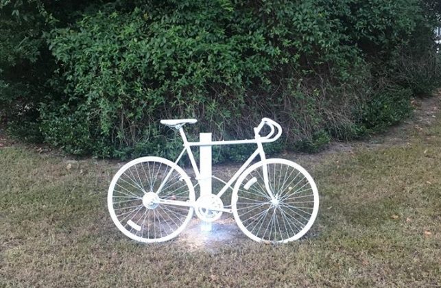 Mourners have placed a “ghost bike,” a memorial bike painted white, at the site of the accident to remember Brian Utne who passed away on Oct. 25 after a hit-and-run. (WYDaily/Courtesy Patrick Johnston)